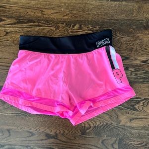Pink athletic shorts, size M